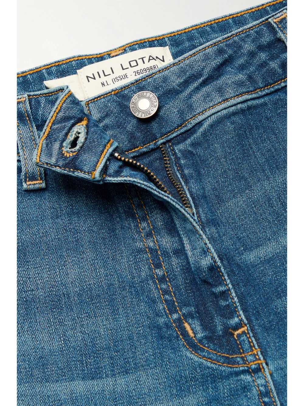 Close-up detail of the Nili Lotan Megan High-rise Wide-leg Jeans