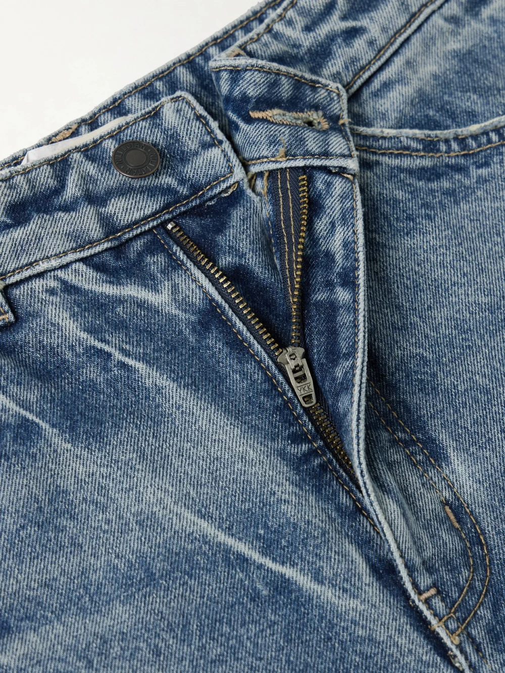 Close-up detail of the Nili Lotan Otis Mid-rise Barrel-leg Jeans