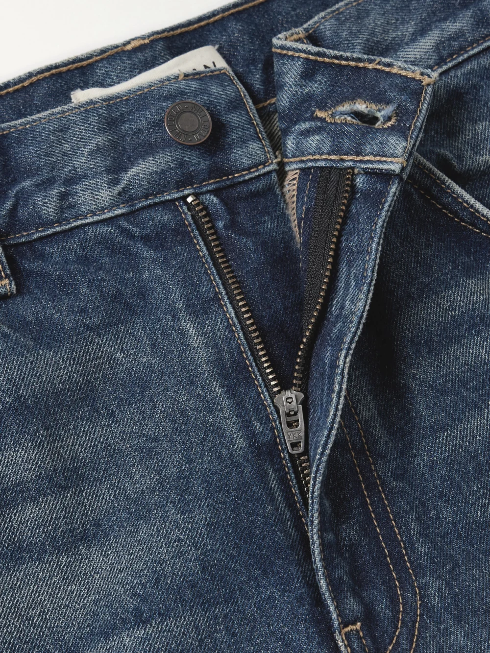 Close-up detail of the Nili Lotan Roe Mid-rise Flared Jeans