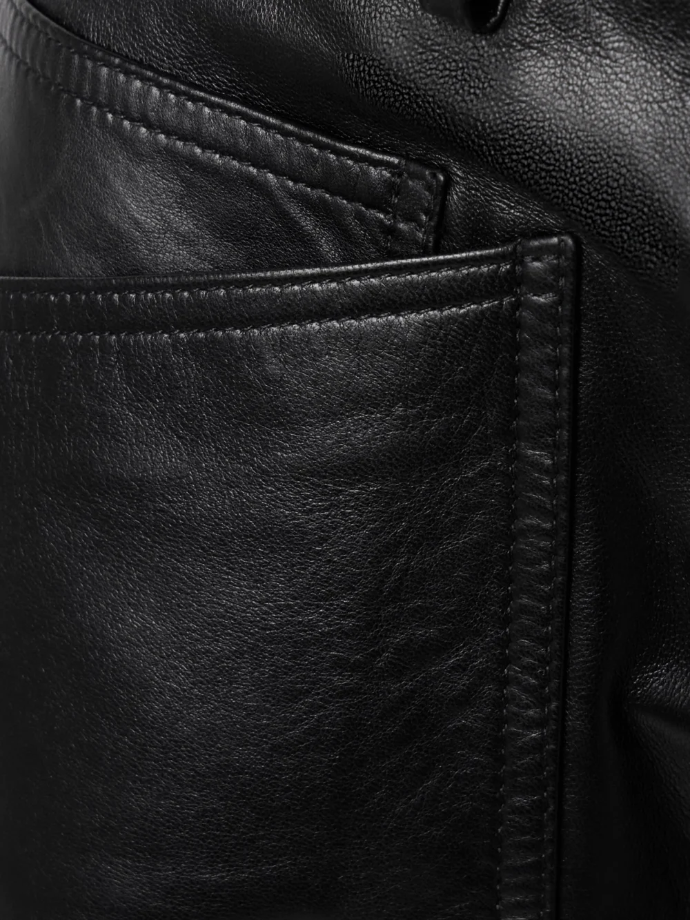 Close-up detail of the Nili Lotan Shon Leather Barrel-leg Pants