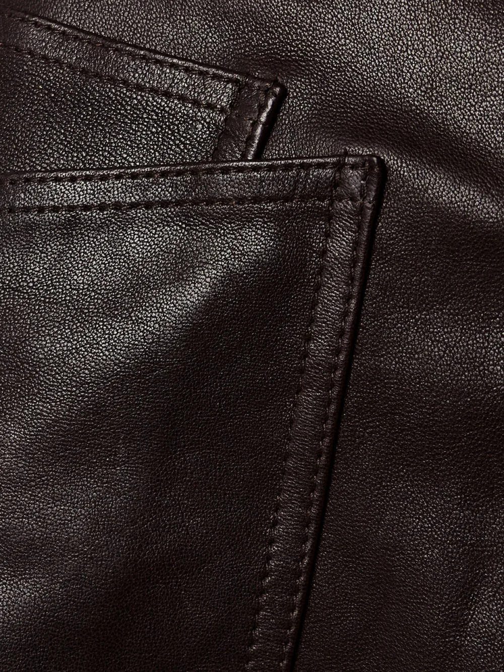 Close-up detail of the Nili Lotan Shon Leather Barrel-leg Pants