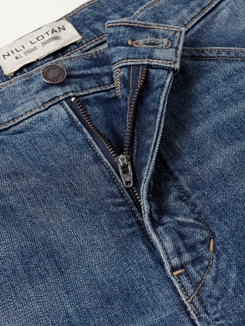Close-up detail of the Nili Lotan Tribeca High-rise Tapered Jeans