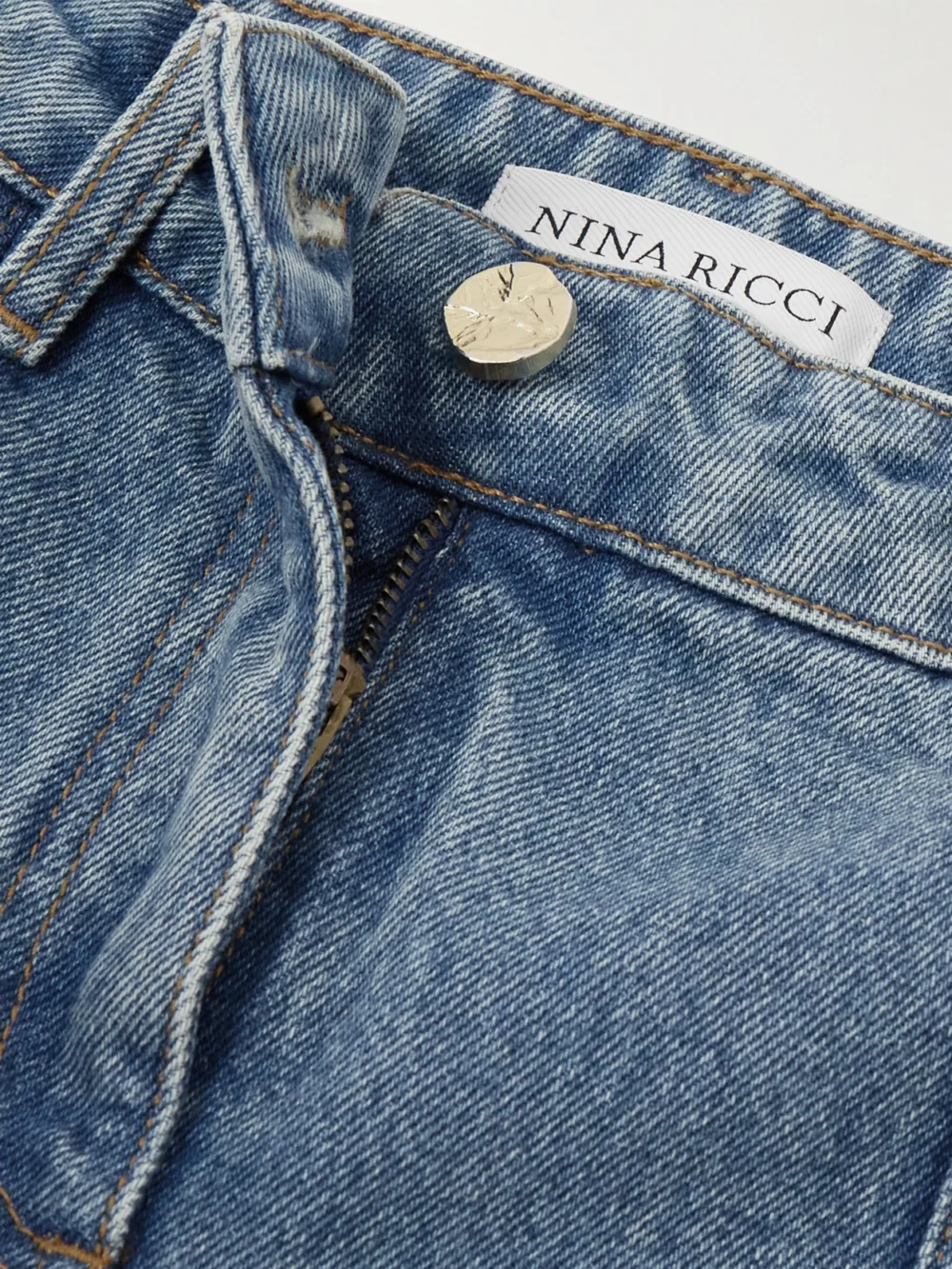 Close-up detail of the Nina Ricci Paneled Mid-rise Flared Jeans