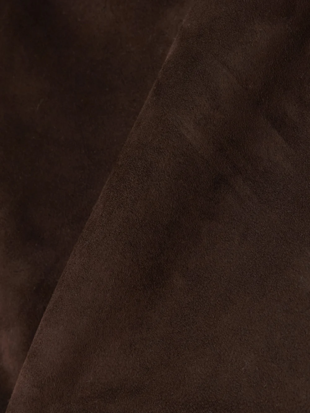 Close-up detail of the Nour Hammour Avery Suede Mini Skirt