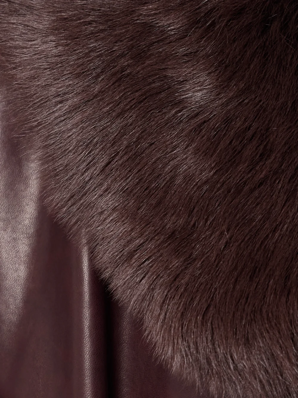 Close-up detail of the Nour Hammour Briona Belted Shearling-trimmed Leather Coat