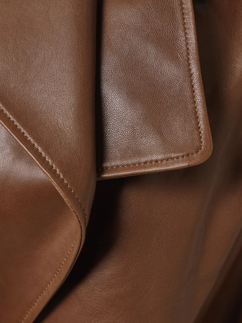 Close-up detail of the Nour Hammour Cisely Belted Leather Trench Coat