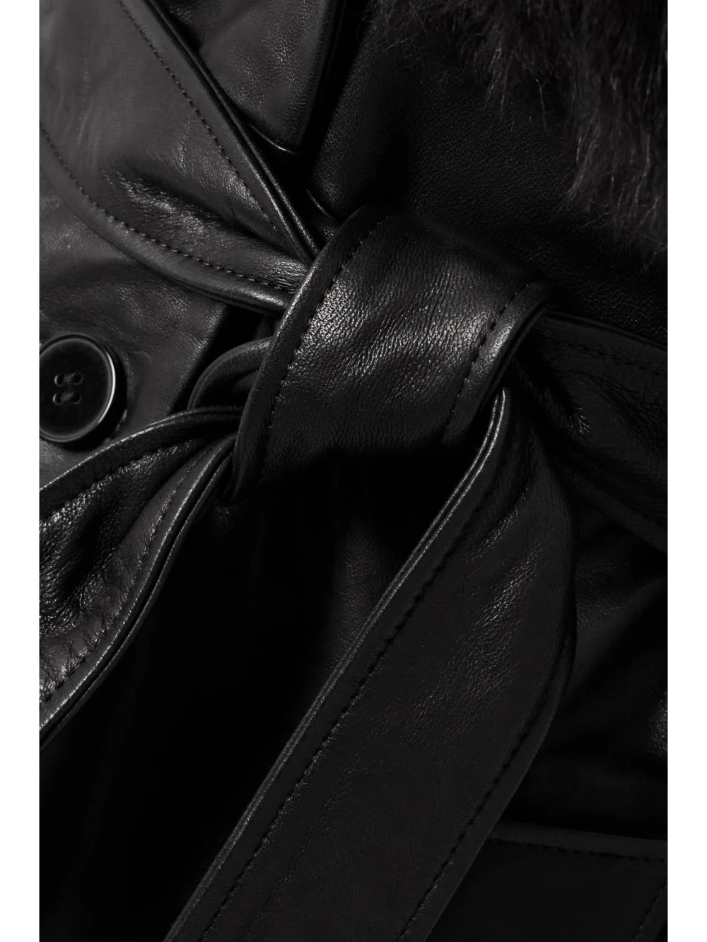 Close-up detail of the Nour Hammour Dakota Belted Shearling-trimmed Leather Coat