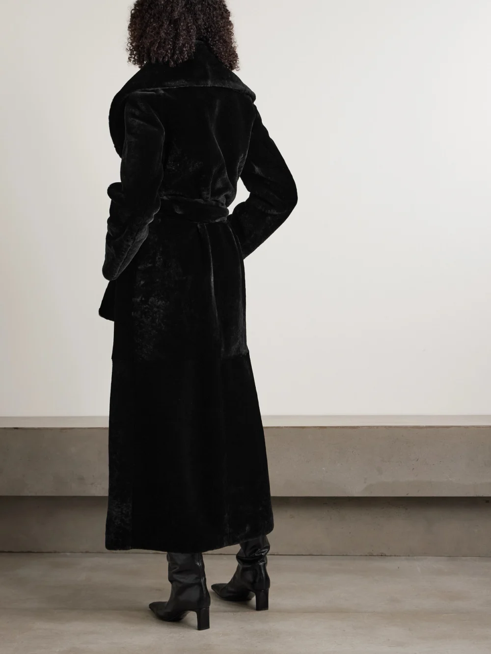 Back view of the Nour Hammour Giovanna Belted Shearling Coat
