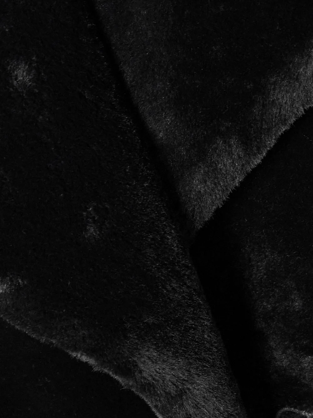 Close-up detail of the Nour Hammour Giovanna Belted Shearling Coat
