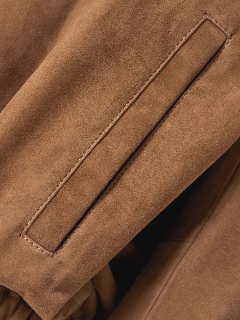 Close-up detail of the Nour Hammour Leo Paneled Suede Hoodie