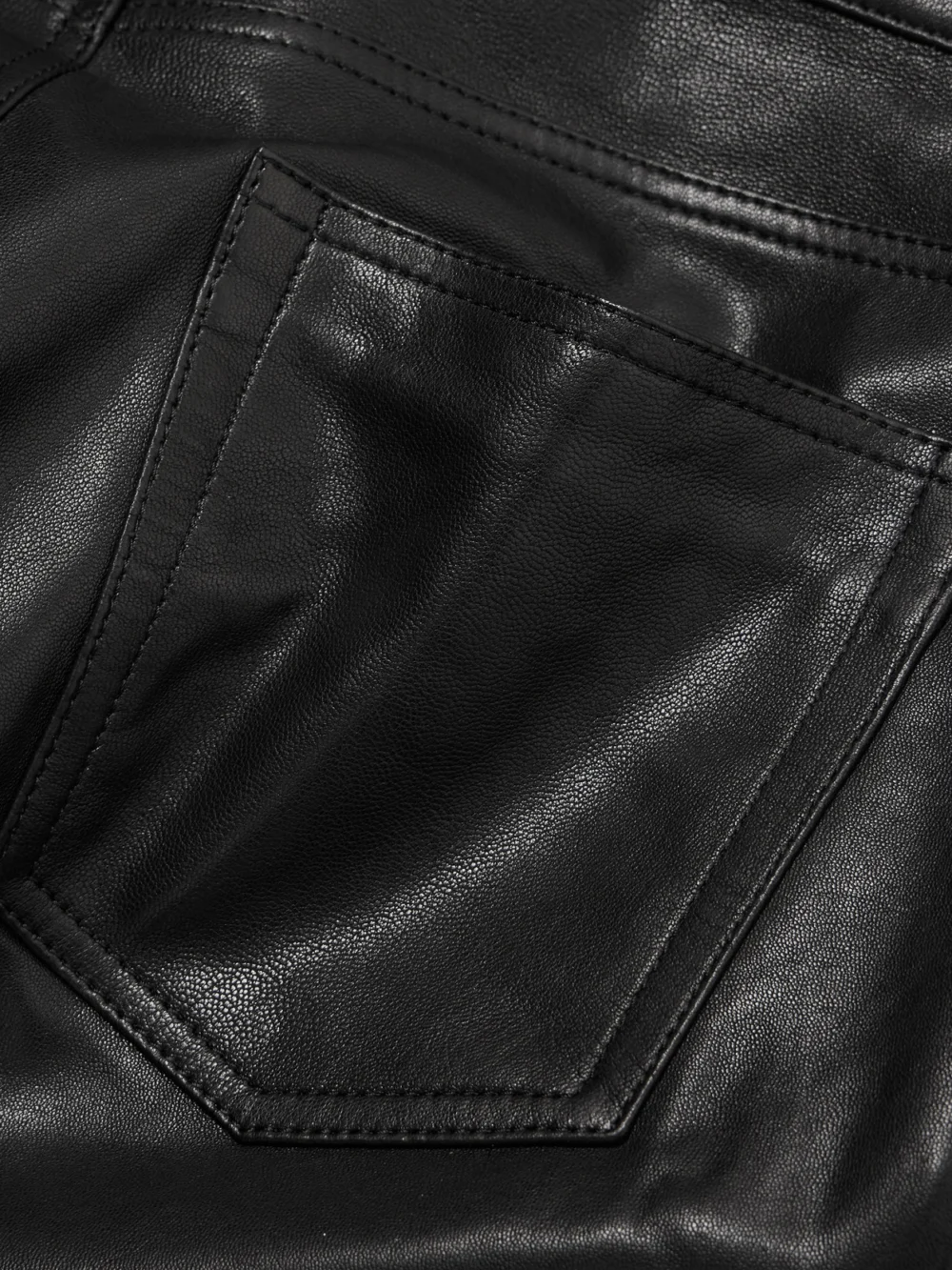 Close-up detail of the Nour Hammour Milo Paneled Leather Wide-leg Pants