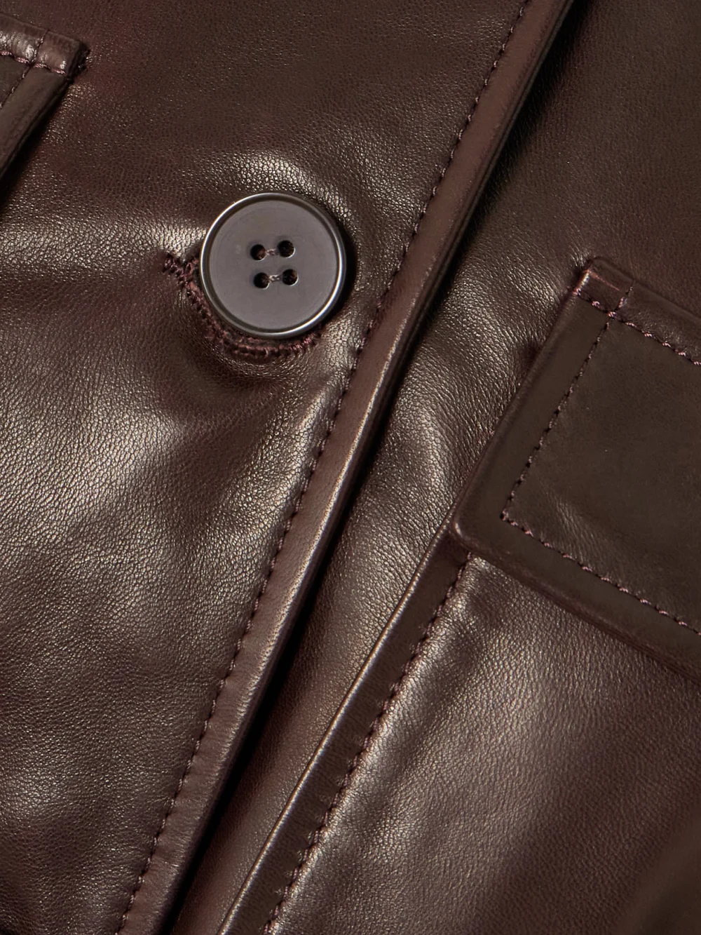 Close-up detail of the Nour Hammour Ramona Belted Paneled Leather Jacket