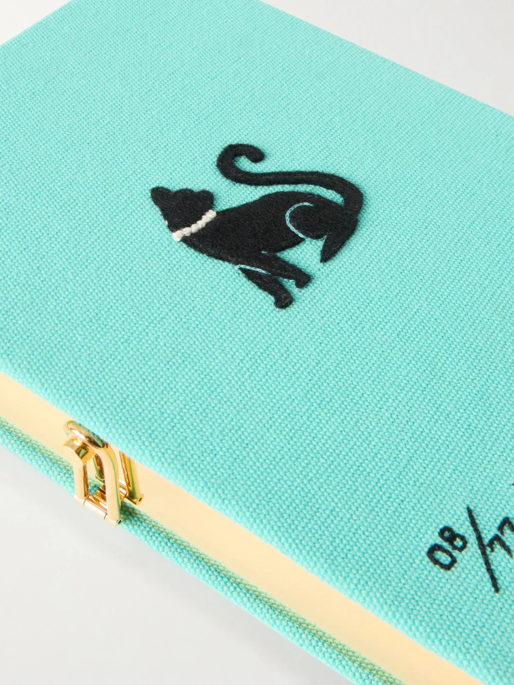 Close-up detail of the Olympia Le-Tan Breakfast At Tiffany's Appliquéd Embroidered Canvas Clutch