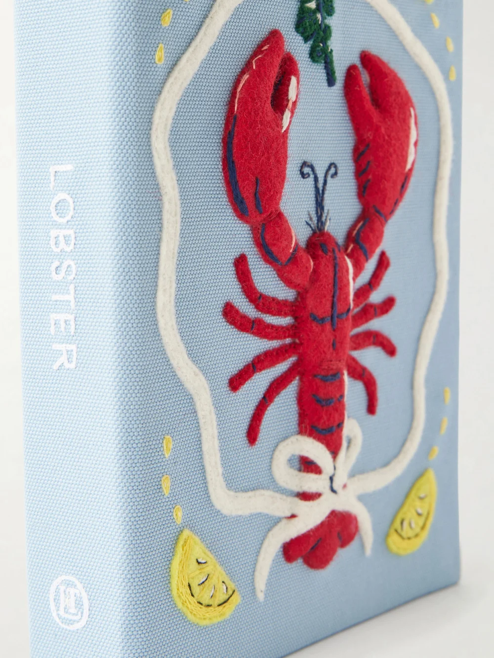 Close-up detail of the Olympia Le-Tan Lobster Appliquéd Embroidered Canvas Clutch