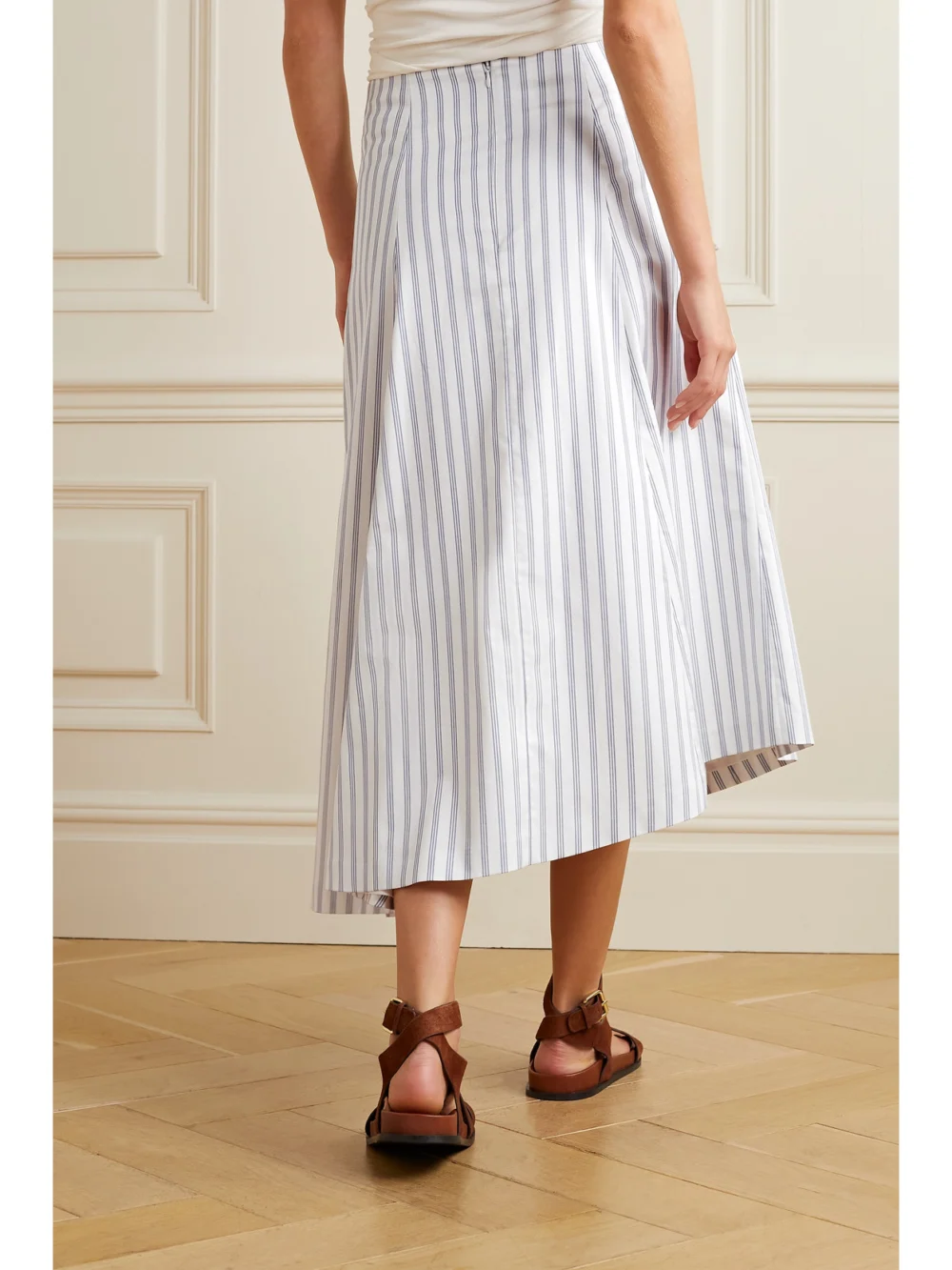 Back view of the Partow Ivy Asymmetric Striped Cotton-twill Midi Skirt