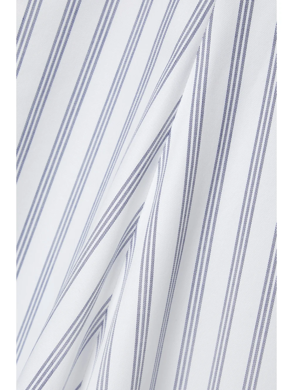 Close-up detail of the Partow Ivy Asymmetric Striped Cotton-twill Midi Skirt
