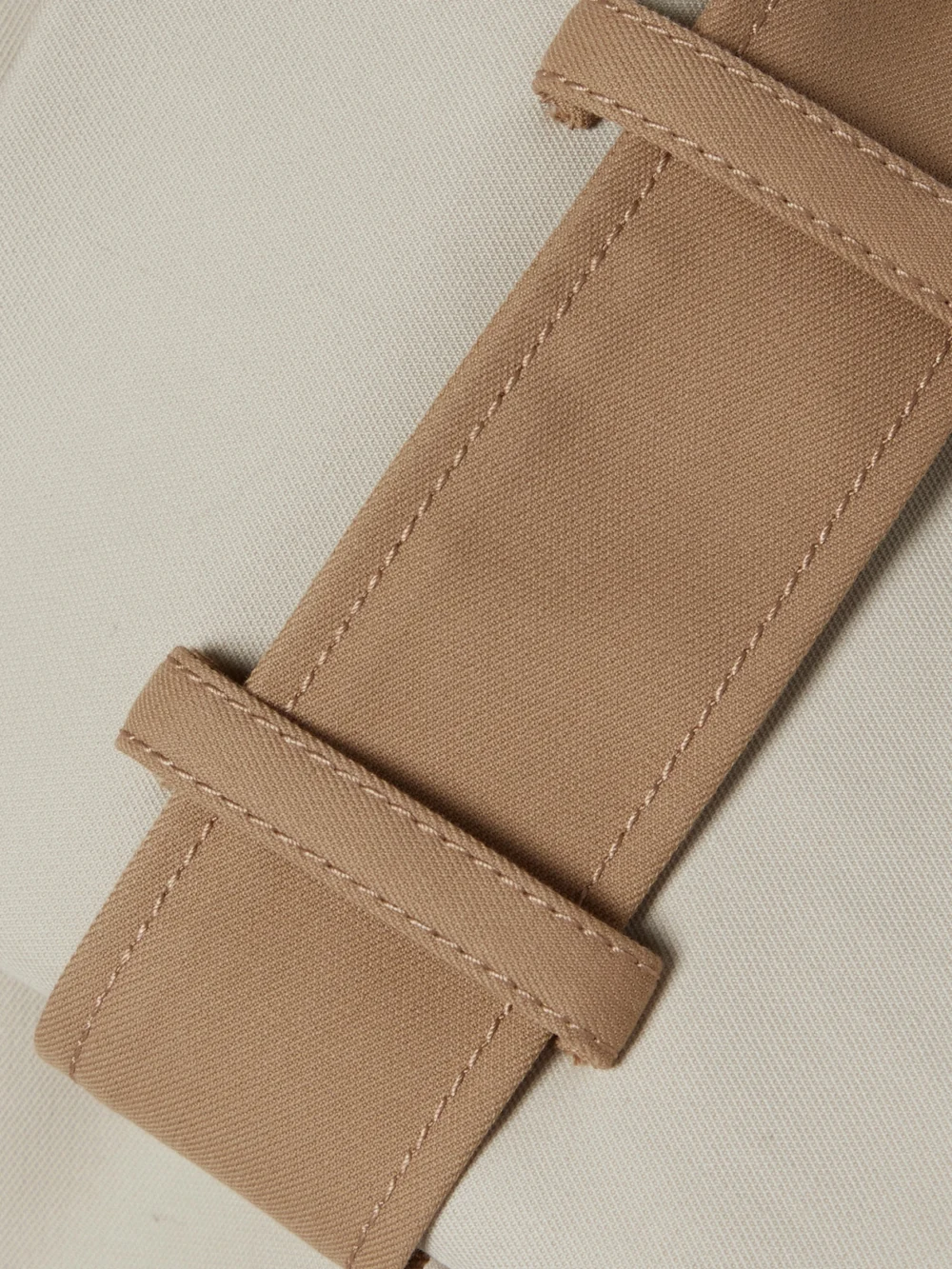 Close-up detail of the Partow Mason Cutout Cotton-twill Trench Coat