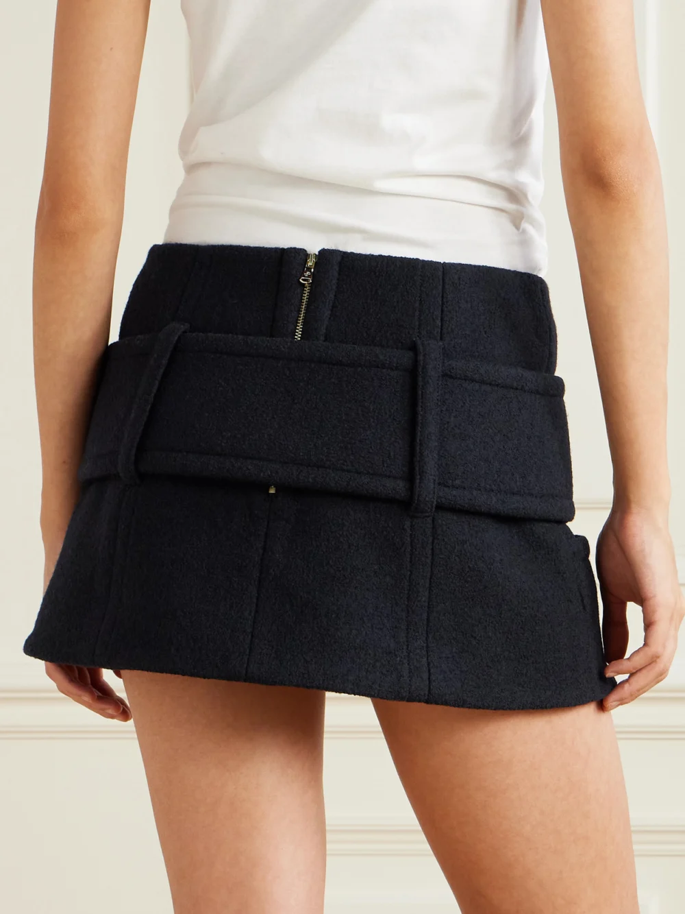 Back view of the Patou Belted Wool Mini Skirt