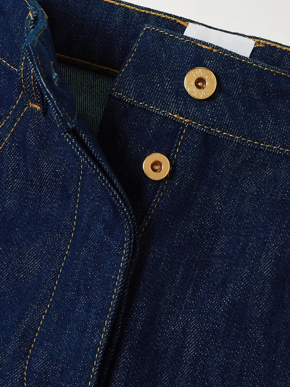 Close-up detail of the Patou Cropped High-rise Straight-leg Jeans