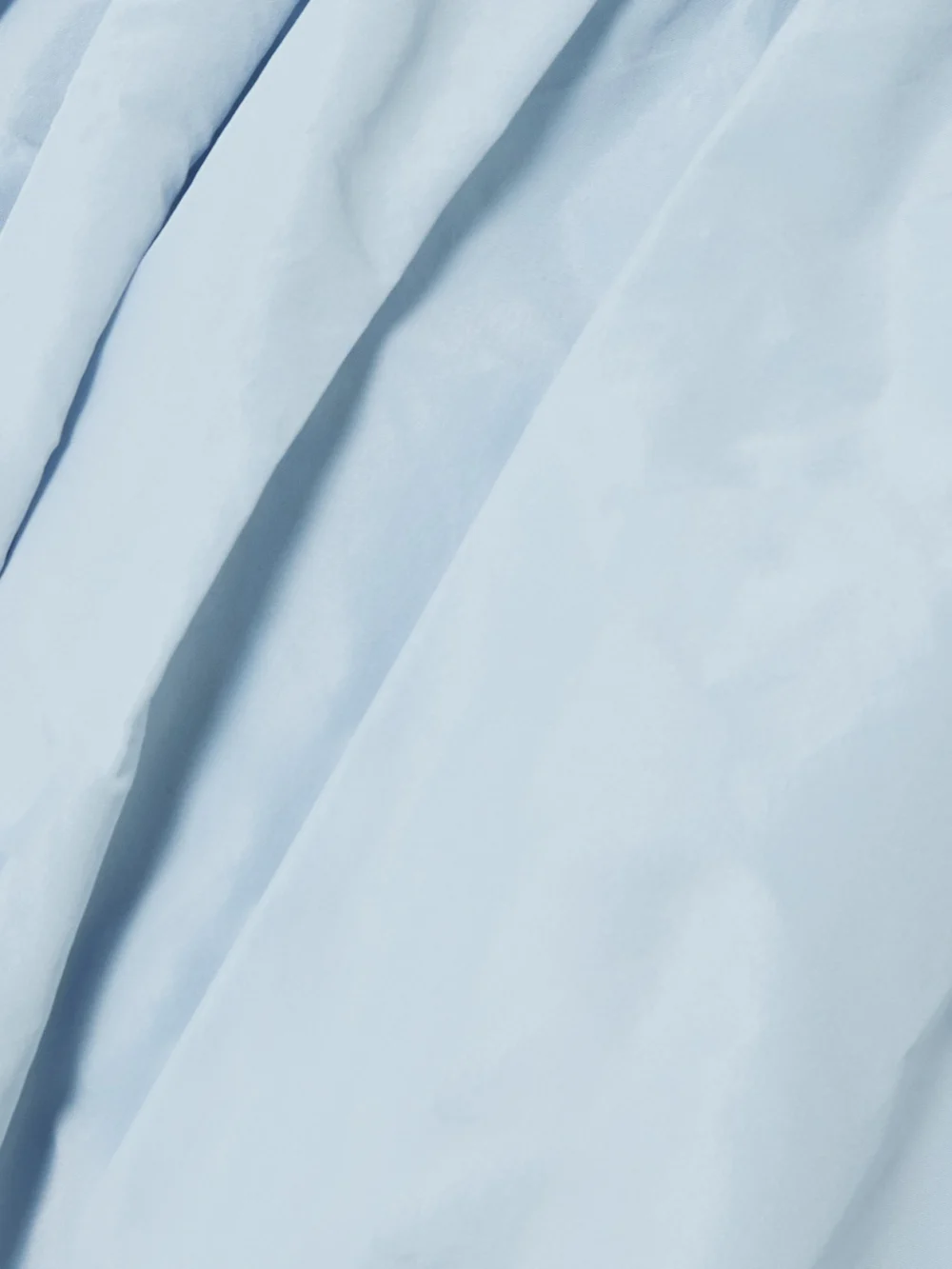 Close-up detail of the Patou Gathered Poplin Mini Skirt