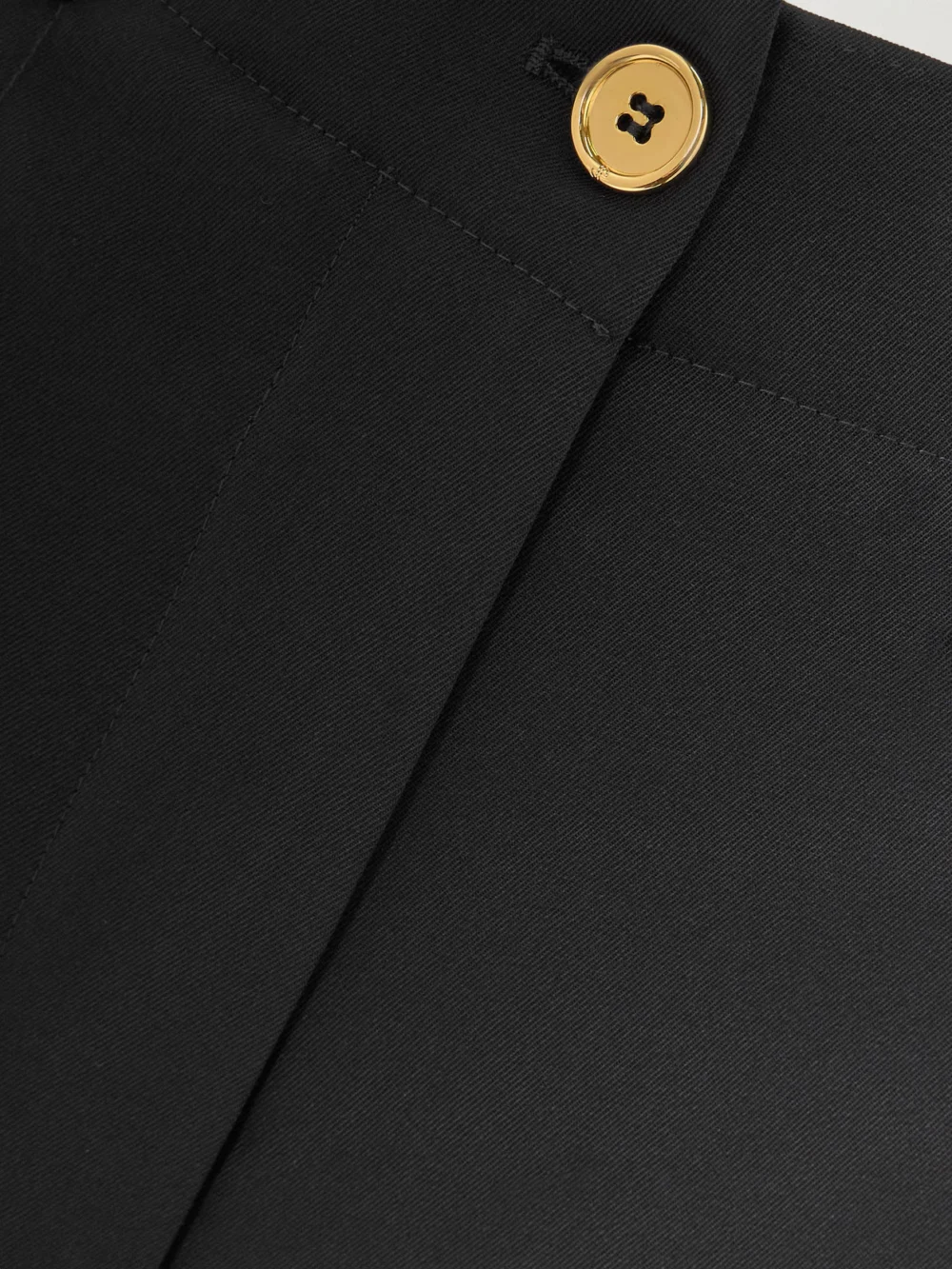 Close-up detail of the Patou Iconic Wool-blend Wide-leg Twill Pants