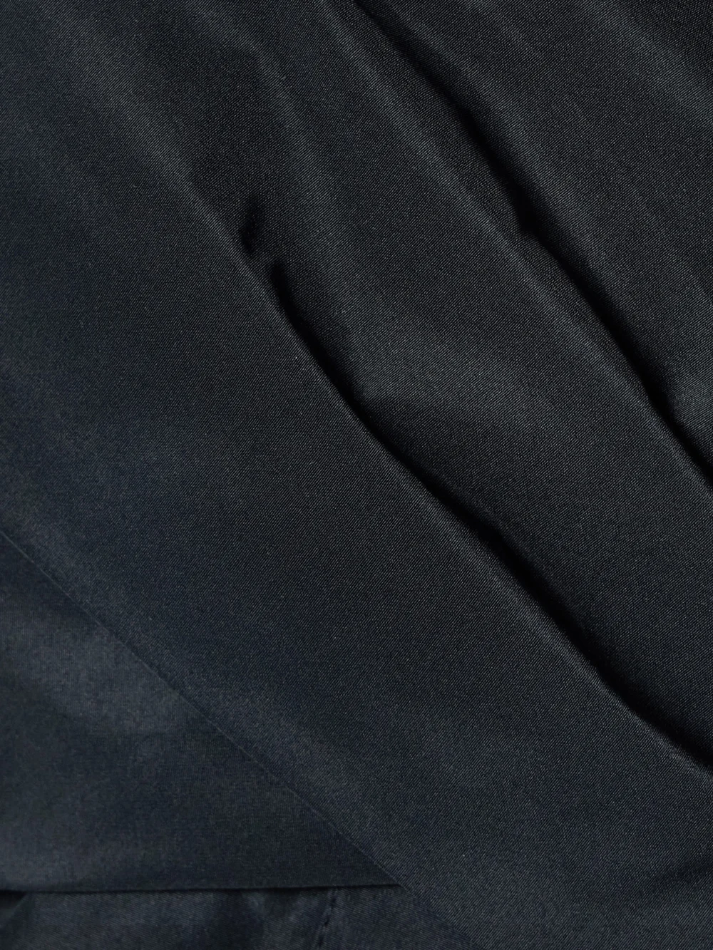 Close-up detail of the Patou Off-the-shoulder Wrap-effect Sateen Blouse