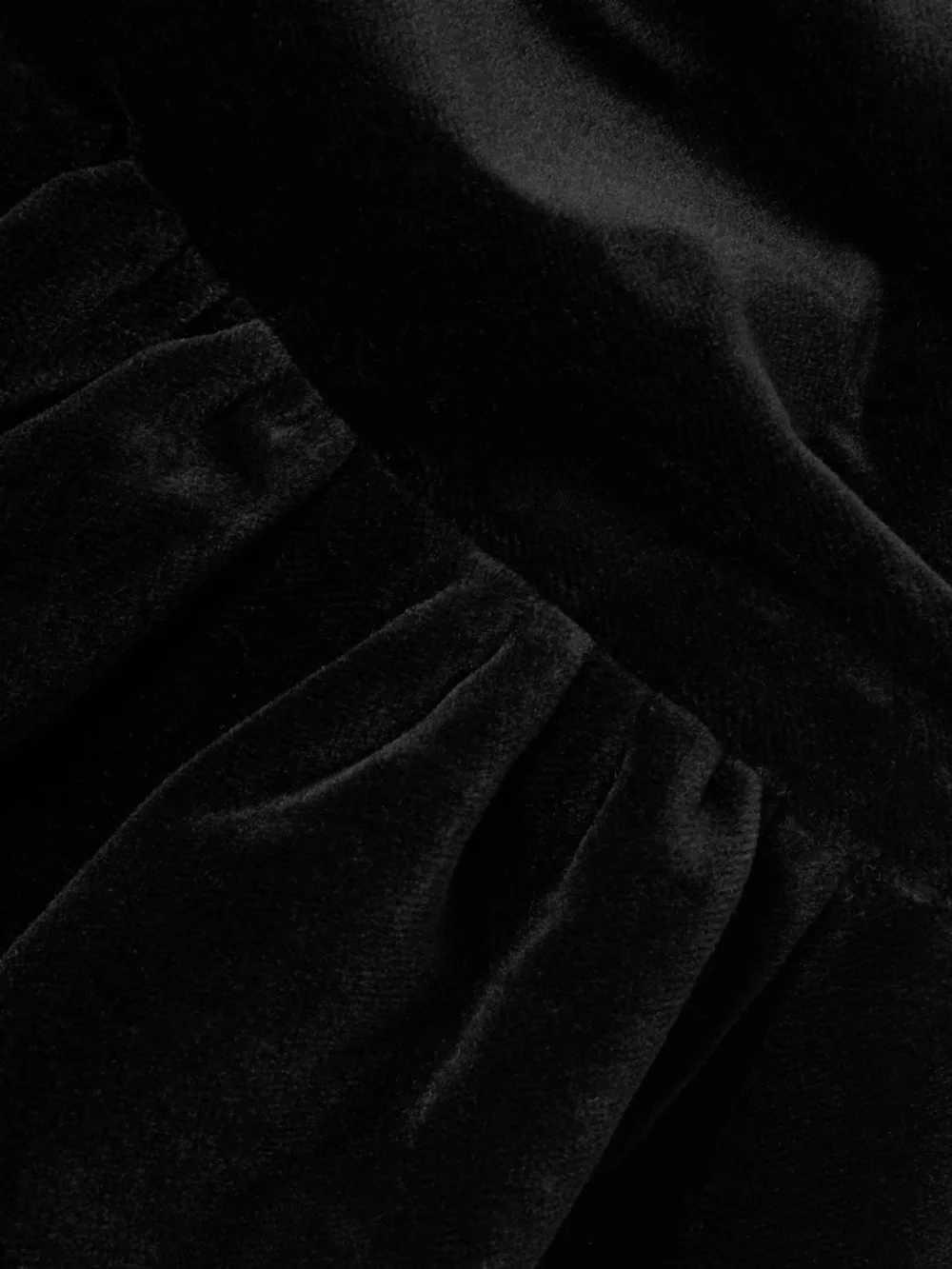 Close-up detail of the Patou Open-back Ruched Cotton-velvet Mini Dress
