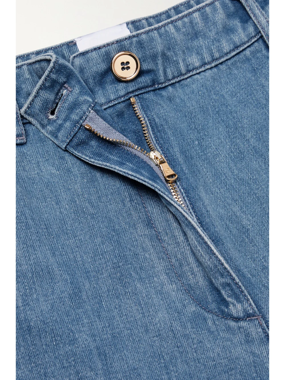 Close-up detail of the Patou Paneled Mid-rise Straight-leg Jeans