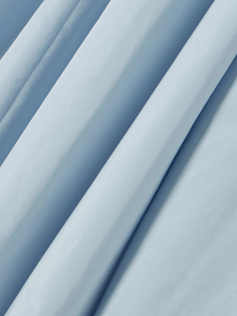 Close-up detail of the Patou Pleated Poplin Halterneck Midi Dress