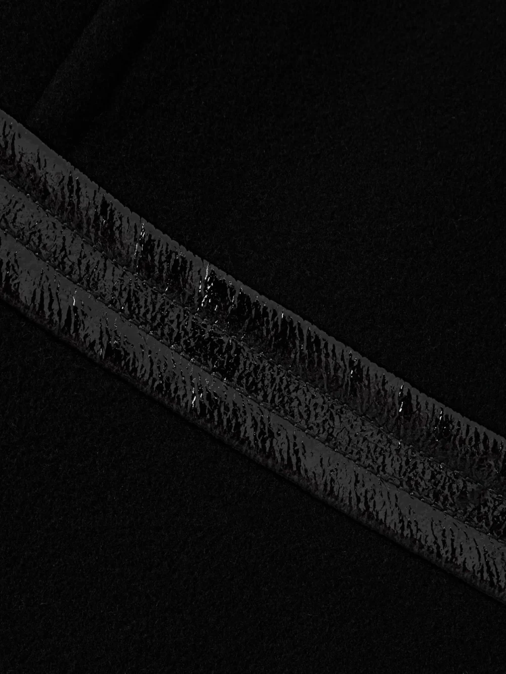 Close-up detail of the Patou Vinyl-trimmed Wool-blend Mini Dress