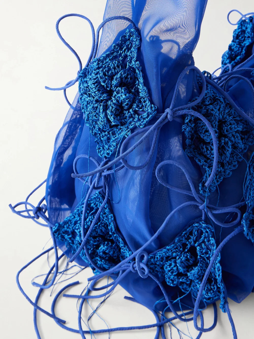 Close-up detail of the Pauline Dujancourt Fringed Crochet and Lace-trimmed Organza Shoulder Bag