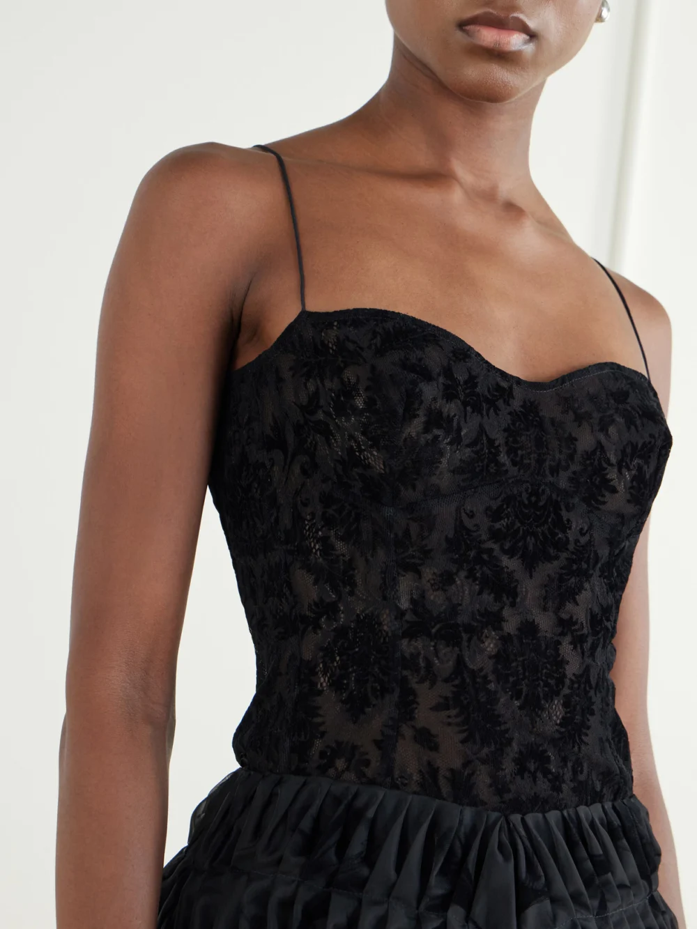 Close-up detail of the Pauline Dujancourt Liqaa Velvet-lace Bodysuit