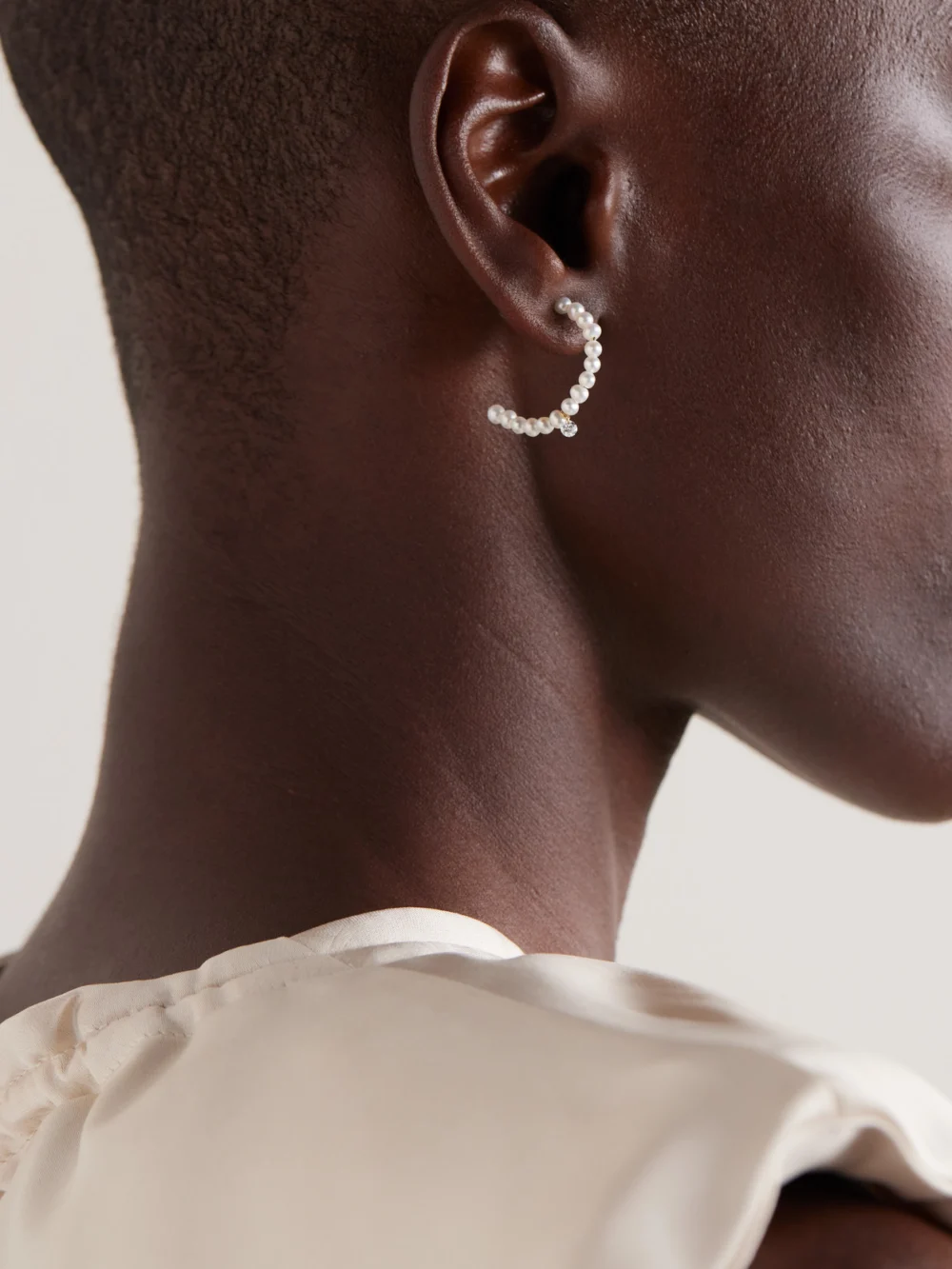 Persée 18-karat Gold, Pearl and Diamond Earrings, styled view