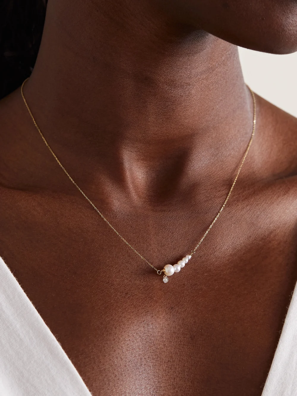 Persée 18-karat Gold, Pearl and Diamond Necklace, styled view