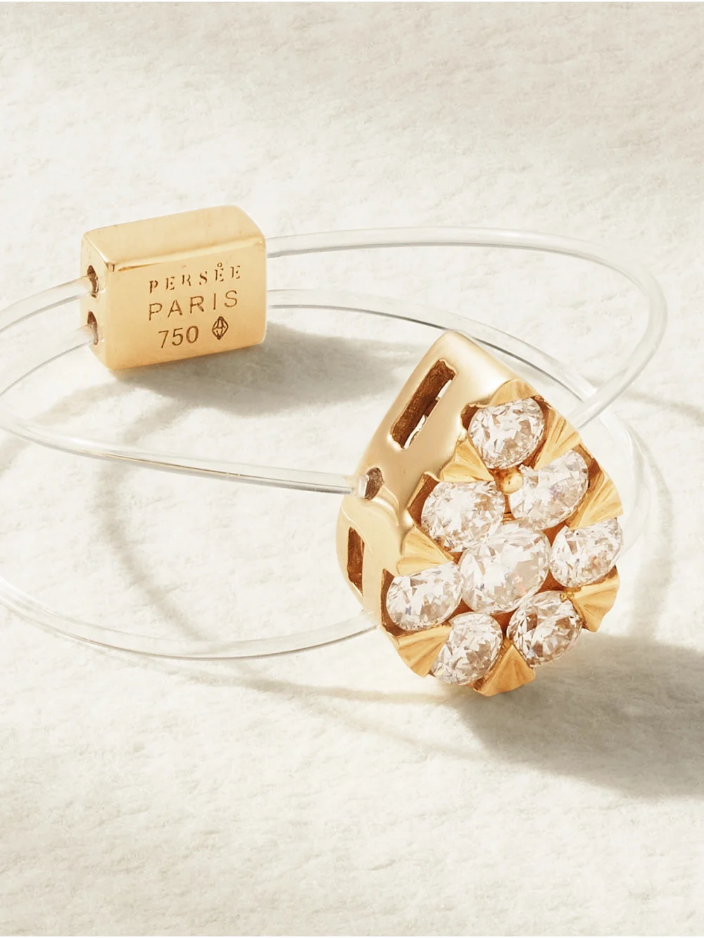 Close-up detail of the Persée Floating 18-karat Gold, Elastic and Diamond Ring
