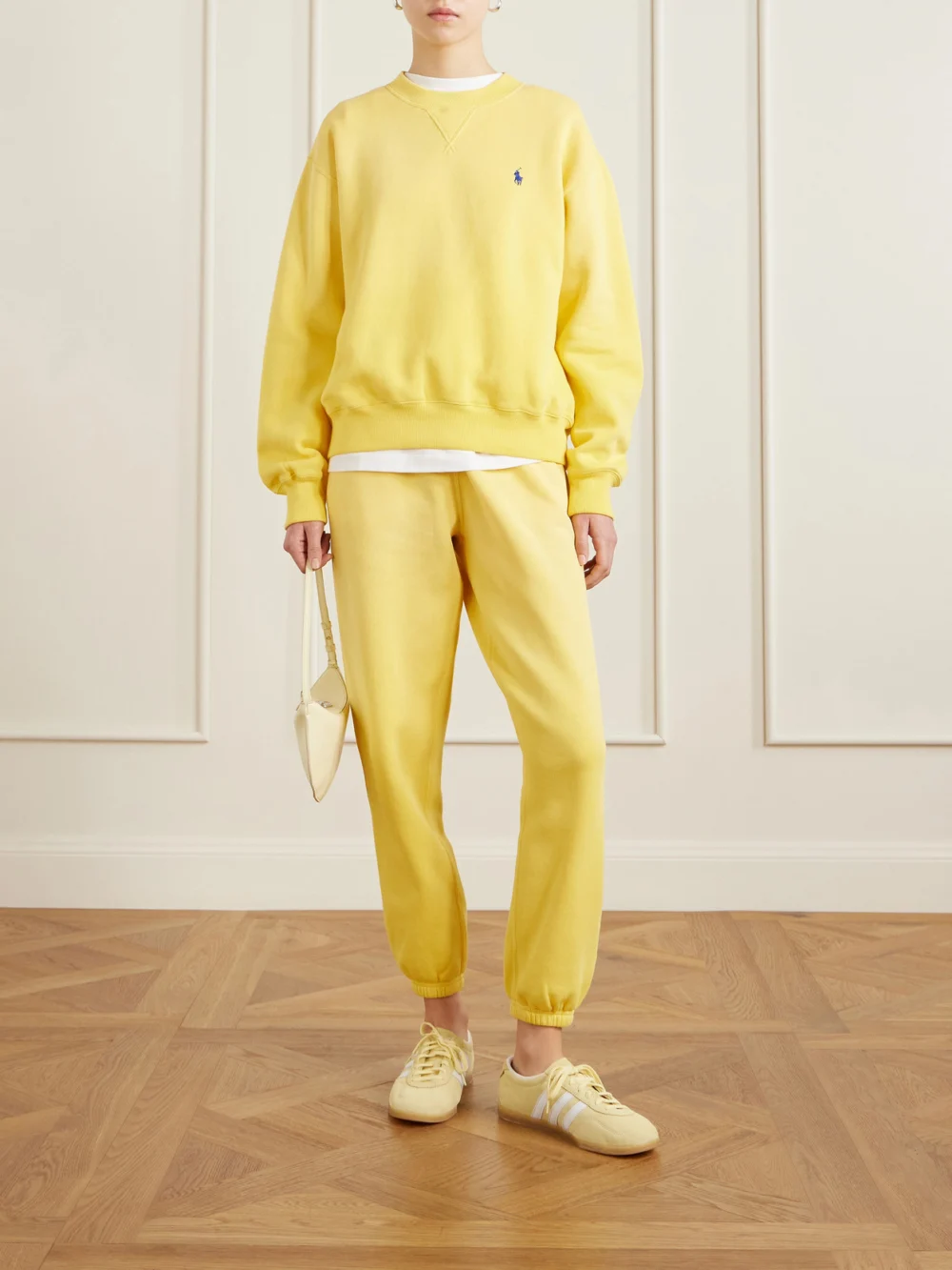 Polo Ralph Lauren Embroidered Cotton-blend Fleece Tapered Sweatpants, worn by a model