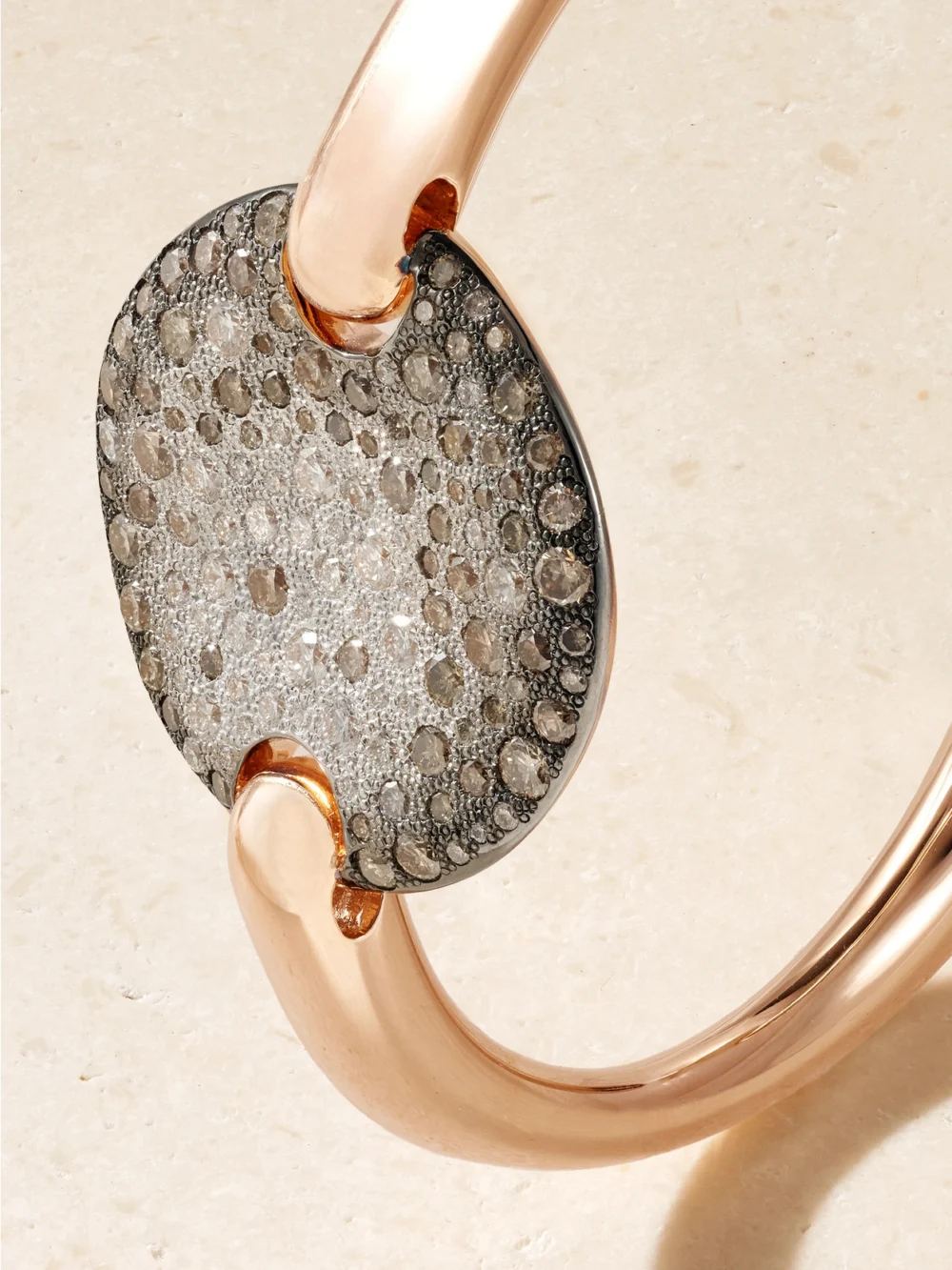 Close-up detail of the Pomellato Sabbia 18-karat Rose and Rhodium-plated White Gold Diamond Bangle