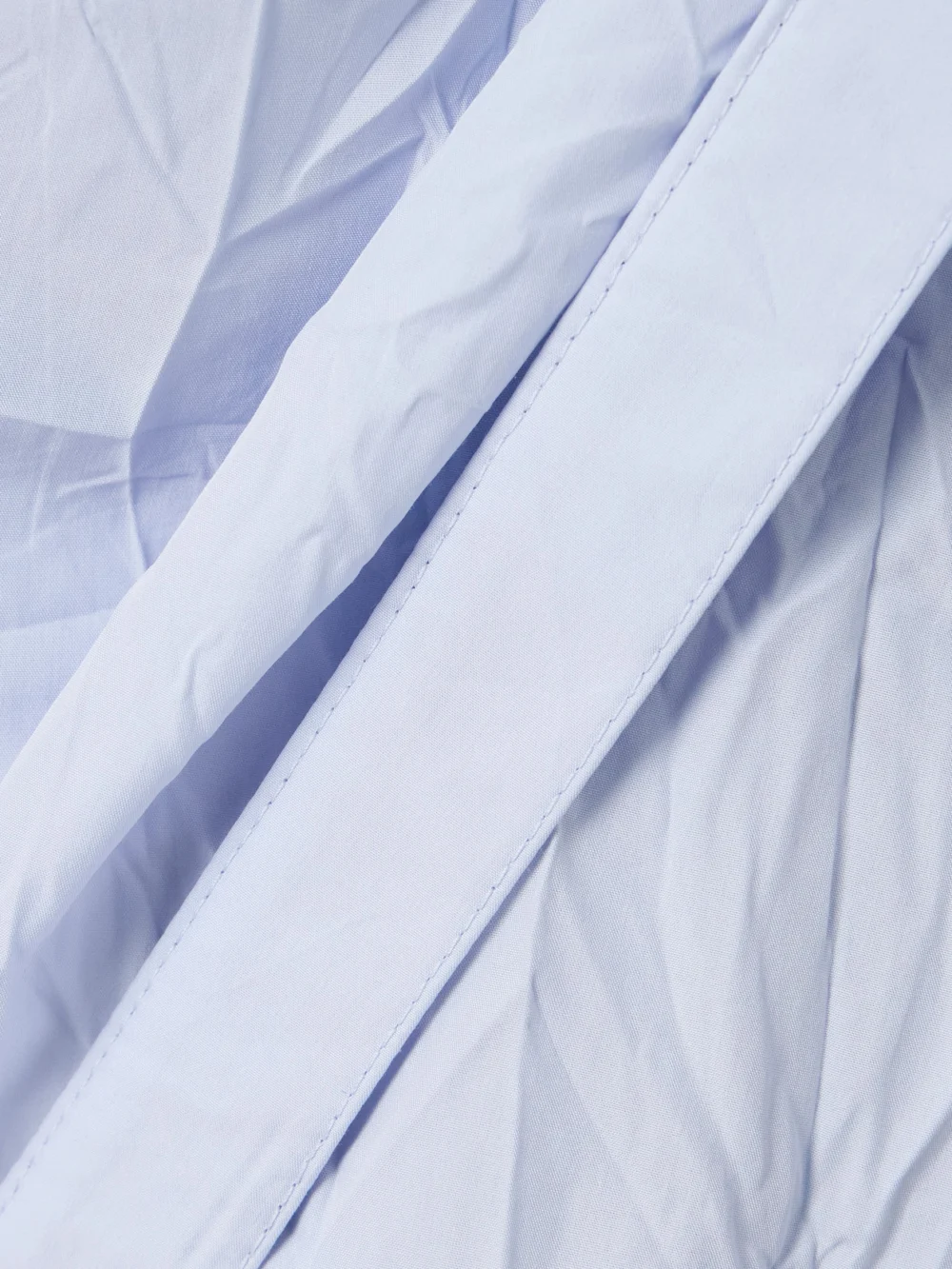 Close-up detail of the Proenza Schouler Alicia Crinkled Cotton-blend Gabardine Midi Wrap Dress