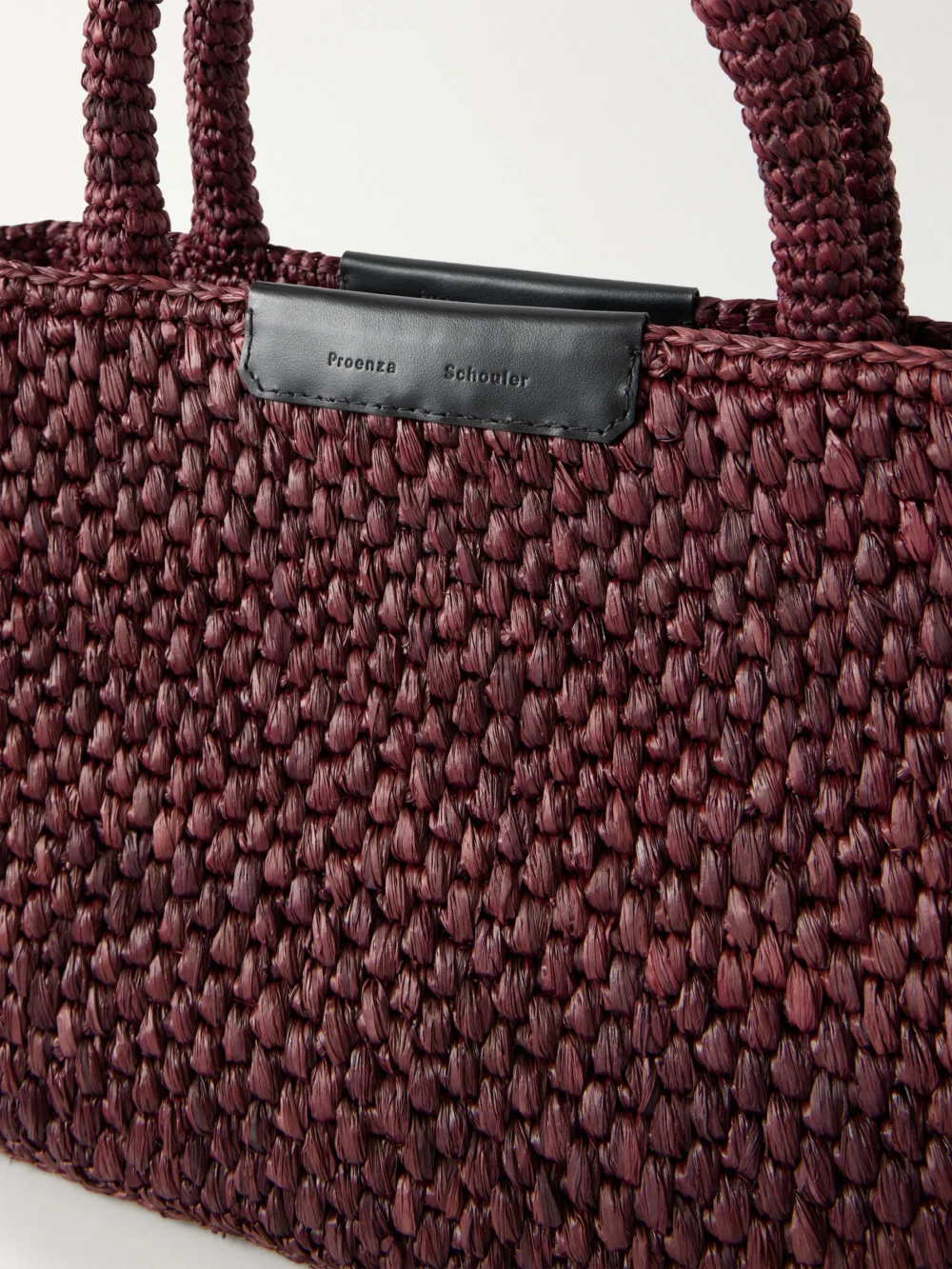 Close-up detail of the Proenza Schouler East West Chelsea Leather-trimmed Raffia Tote