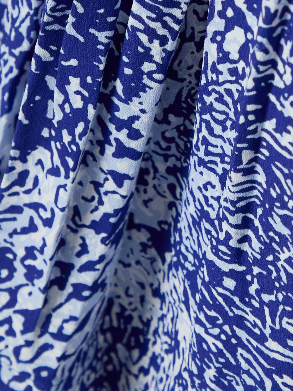 Close-up detail of the Proenza Schouler Simone Pleated Printed Crepe Maxi Dress