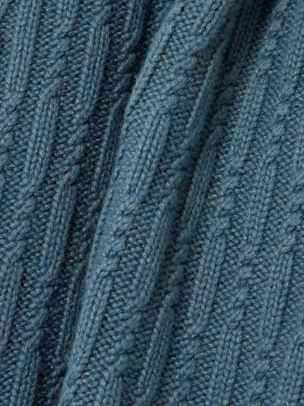 Close-up detail of the Purdey Annabel Cable-knit Cashmere Turtleneck Sweater