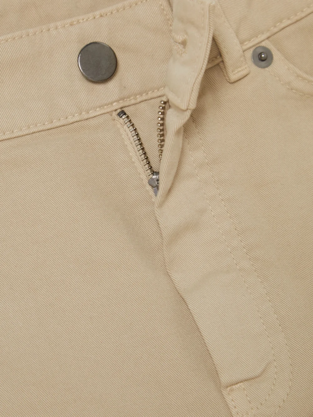 Close-up detail of the Purdey Mid-rise Slim-leg Jeans