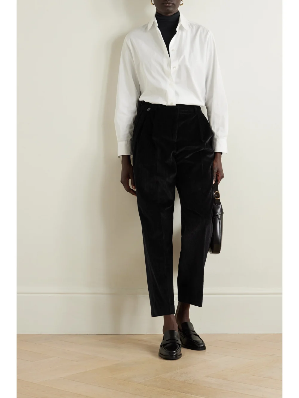 Purdey Pleated Cotton-corduroy Tapered Pants, worn by a model