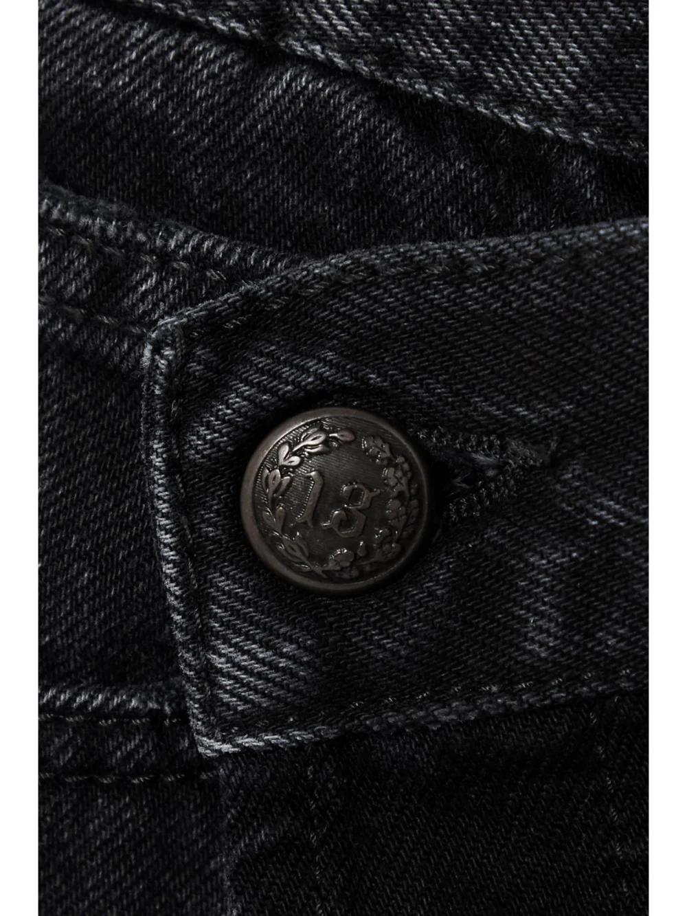 Close-up detail of the R13 Crossover Asymmetric Distressed Denim Shorts