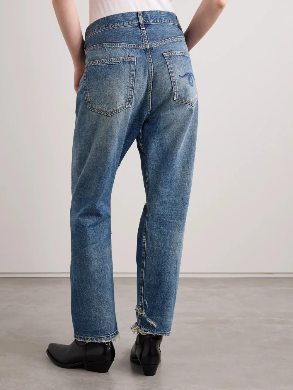 Back view of the R13 Crossover Asymmetric Distressed Low-rise Straight-leg Jeans