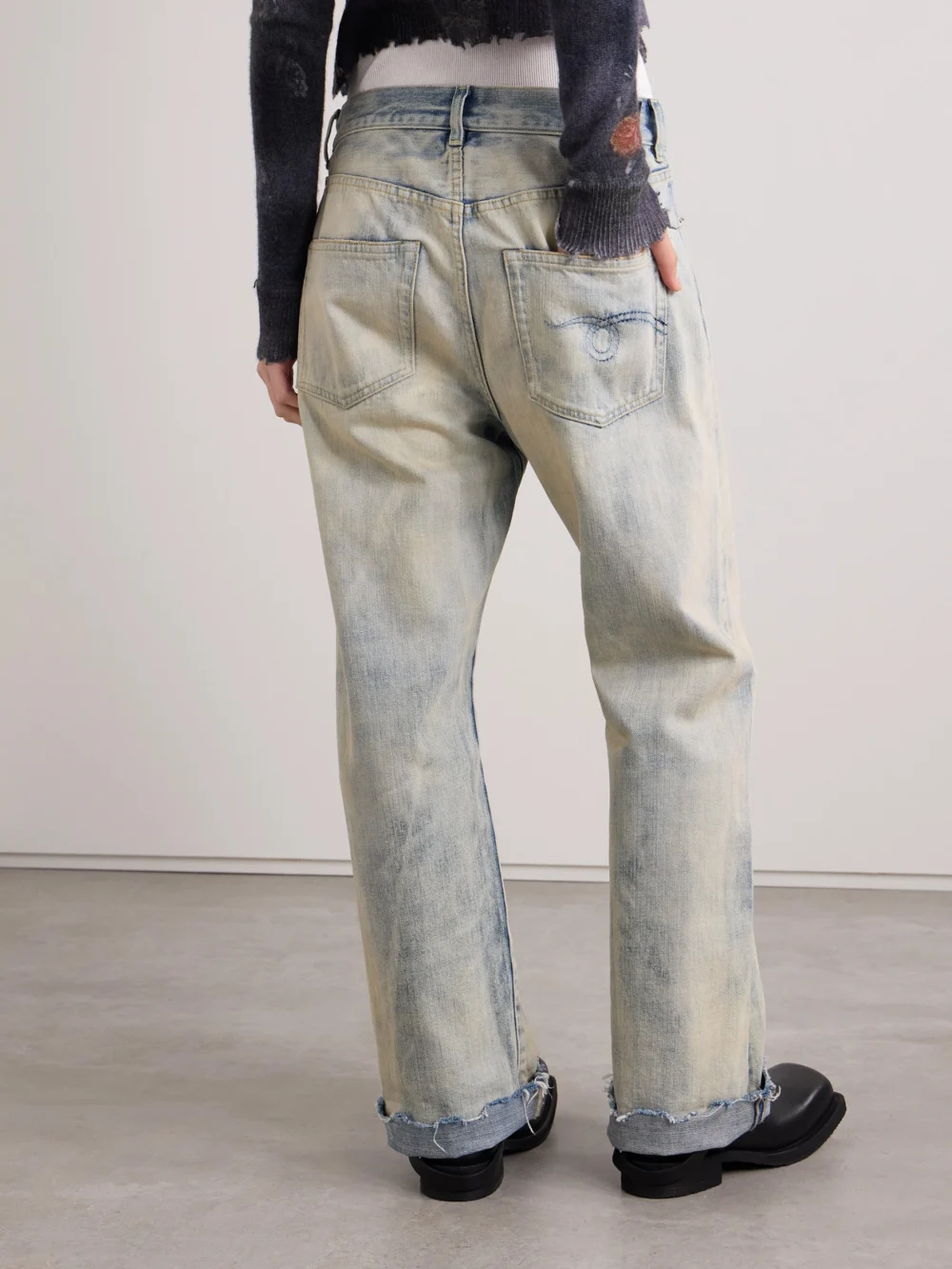 Back view of the R13 Cuffed X-bf Frayed Low-rise Wide-leg Jeans