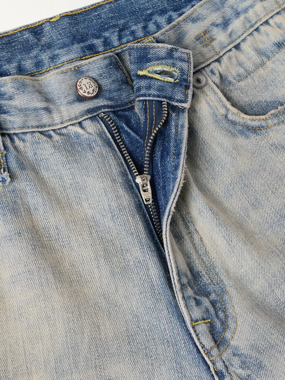 Close-up detail of the R13 Cuffed X-bf Frayed Low-rise Wide-leg Jeans