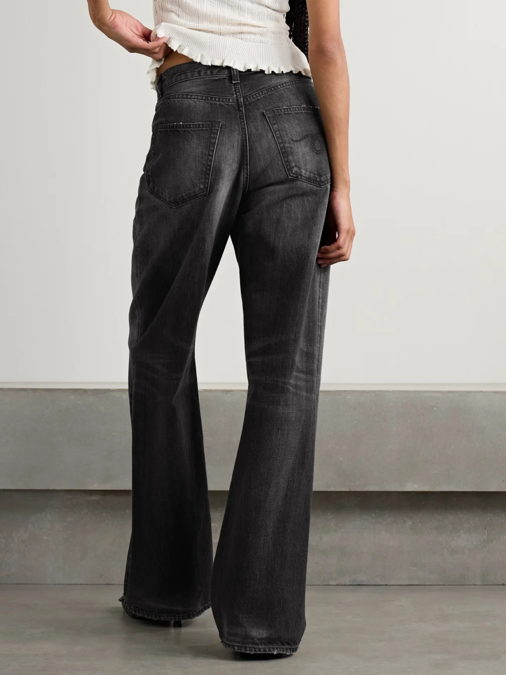 Back view of the R13 D'arcy Loose Distressed Mid-rise Wide-leg Jeans
