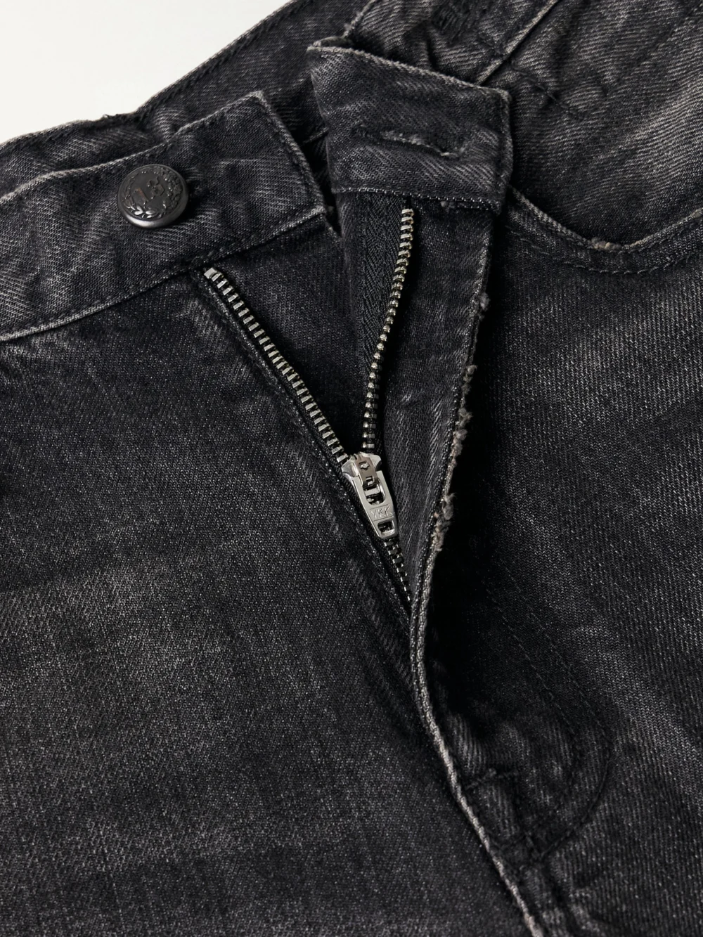 Close-up detail of the R13 D'arcy Loose Distressed Mid-rise Wide-leg Jeans