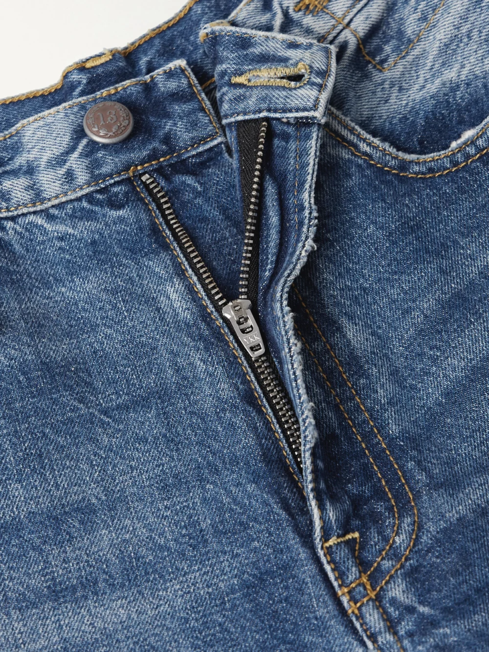 Close-up detail of the R13 D'arcy Loose Distressed Mid-rise Wide-leg Jeans